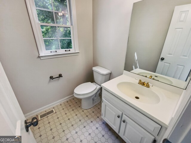 bathroom with vanity and toilet