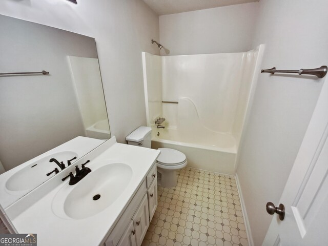 full bathroom with  shower combination, vanity, and toilet