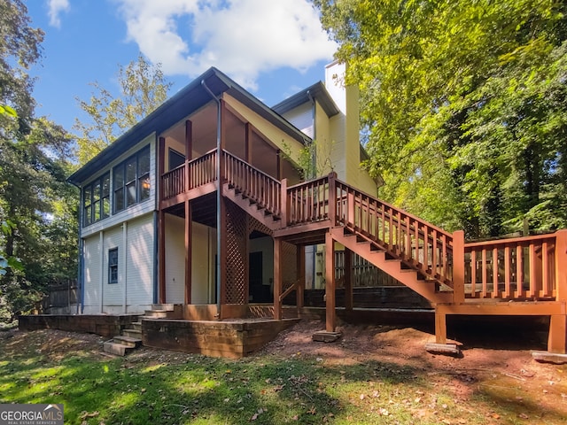 back of house featuring a wooden deck