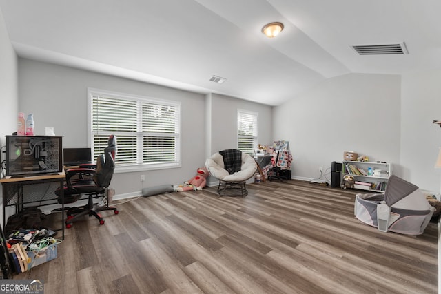 office area featuring wood-type flooring and vaulted ceiling