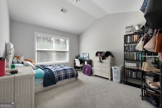 bedroom featuring carpet floors and vaulted ceiling