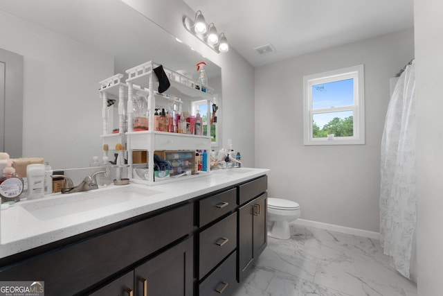 bathroom with vanity and toilet