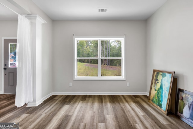 unfurnished living room with hardwood / wood-style floors