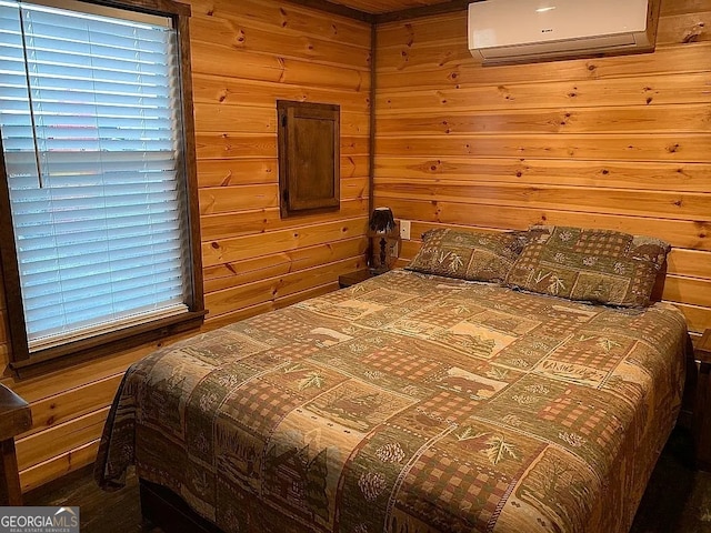 bedroom featuring wooden walls and a wall unit AC