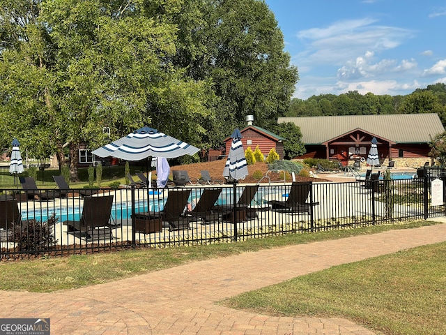 view of playground with a community pool