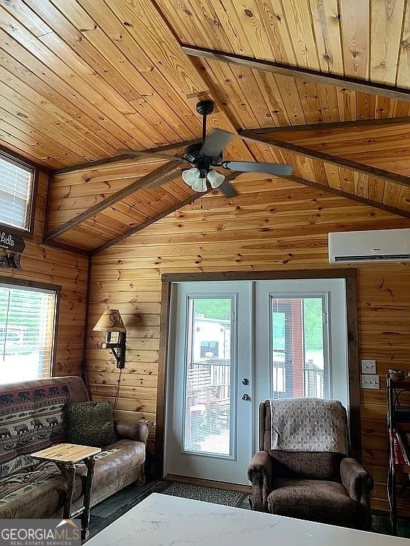 living room featuring wood ceiling, a wall unit AC, lofted ceiling, wood walls, and ceiling fan