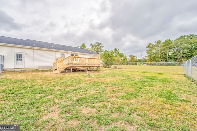 view of yard featuring a wooden deck