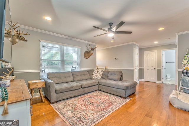 living room with ceiling fan, light hardwood / wood-style flooring, and crown molding