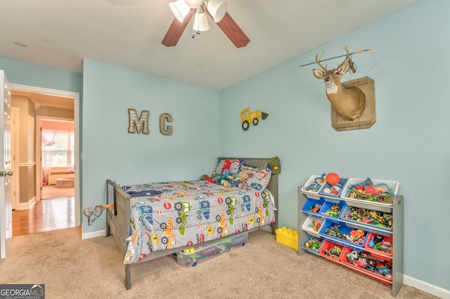 carpeted bedroom with ceiling fan