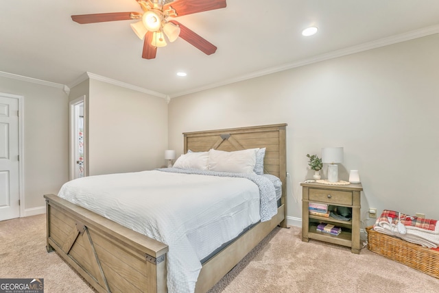 carpeted bedroom with ceiling fan and crown molding