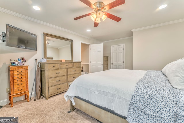 bedroom with ceiling fan, light colored carpet, and ornamental molding