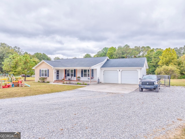 ranch-style home with a playground, a front yard, a porch, and a garage