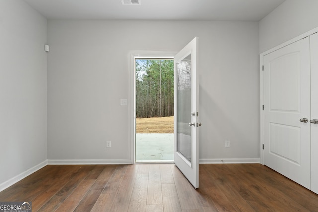 doorway to outside with french doors and dark hardwood / wood-style flooring