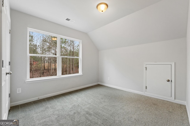 bonus room featuring carpet and lofted ceiling