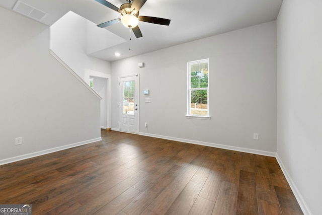 foyer entrance featuring ceiling fan and dark wood-type flooring