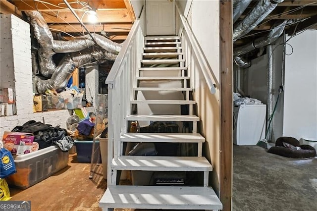 stairs with concrete flooring