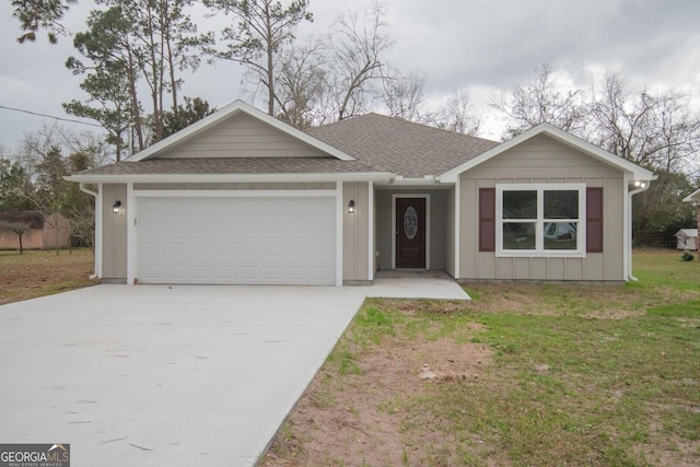 single story home featuring a garage and a front yard