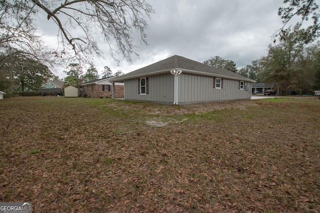 view of home's exterior with a yard