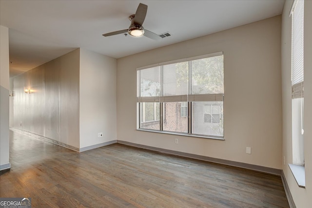 spare room featuring ceiling fan and light wood-type flooring