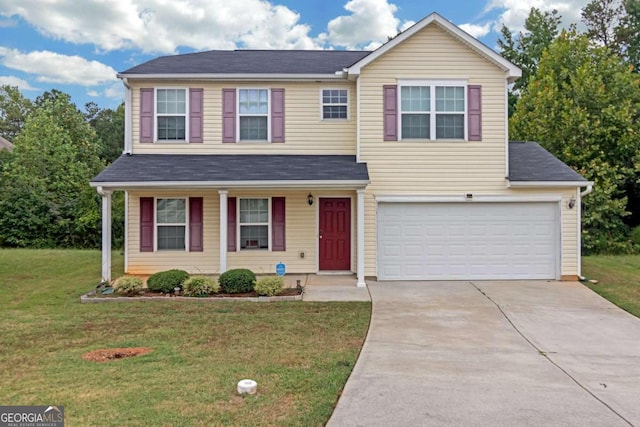 view of front facade featuring a front yard and a garage