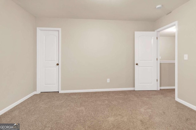 spare room featuring carpet flooring