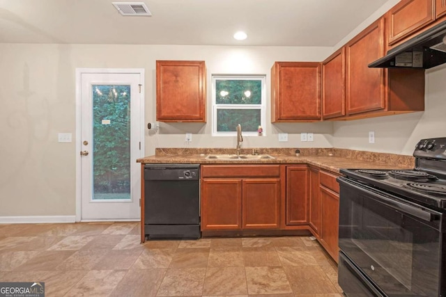 kitchen with exhaust hood, stone counters, sink, and black appliances