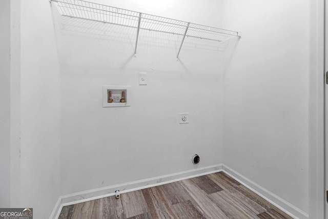 washroom featuring hookup for a washing machine, hardwood / wood-style flooring, and hookup for an electric dryer