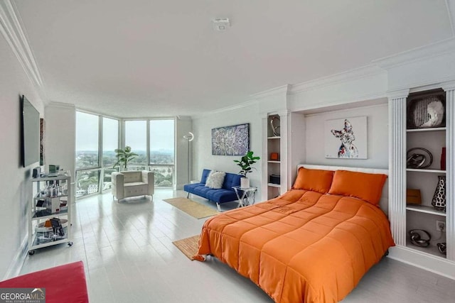 bedroom with light hardwood / wood-style flooring, ornamental molding, floor to ceiling windows, and access to outside