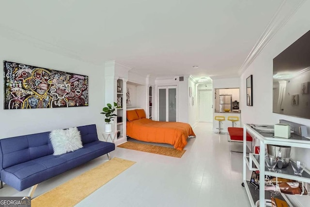 bedroom with wood-type flooring, ornamental molding, stainless steel refrigerator, and decorative columns