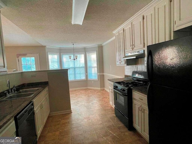 kitchen featuring a textured ceiling, sink, decorative backsplash, and black appliances