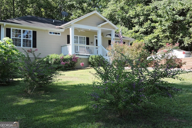 view of front facade with covered porch and a front lawn