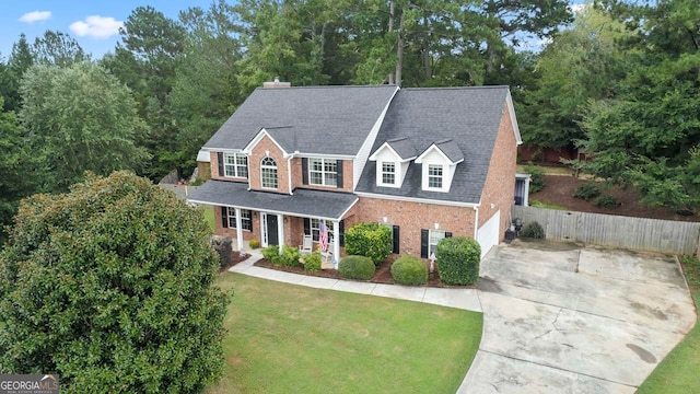 view of front of home featuring a garage and a front lawn