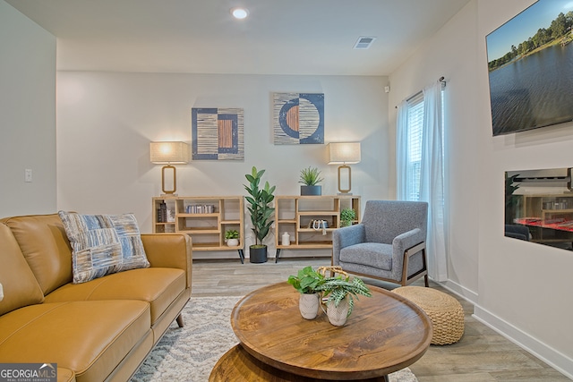 sitting room featuring light hardwood / wood-style floors