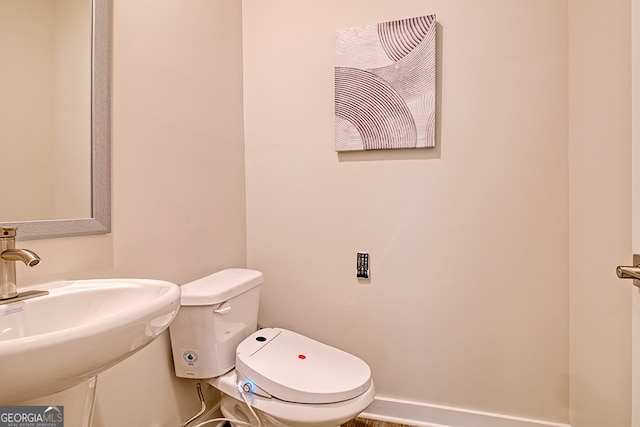 bathroom with sink and toilet