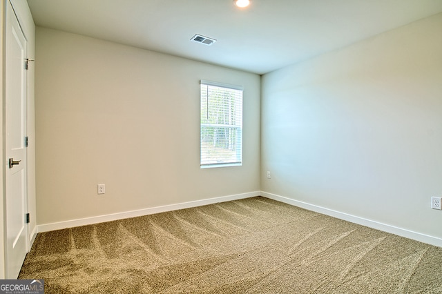 spare room with carpet flooring