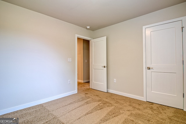 unfurnished bedroom featuring carpet flooring