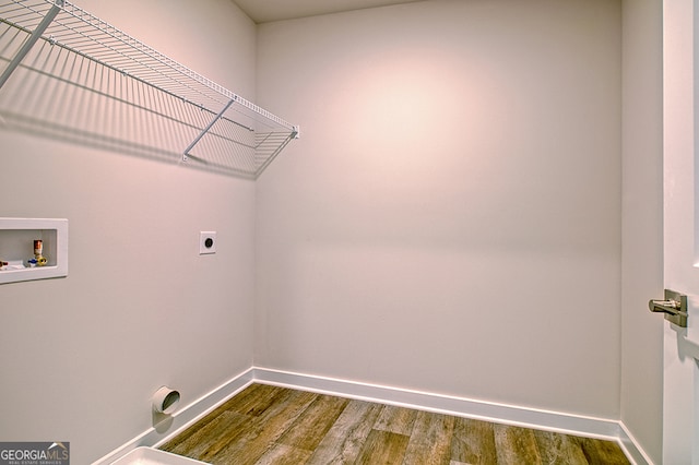 washroom featuring washer hookup, electric dryer hookup, and hardwood / wood-style flooring