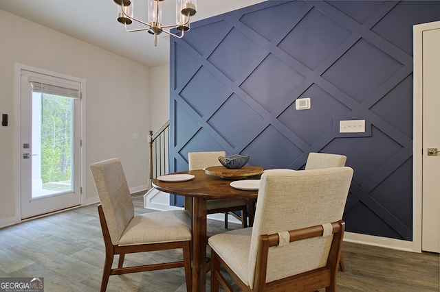 dining area featuring a chandelier and hardwood / wood-style flooring