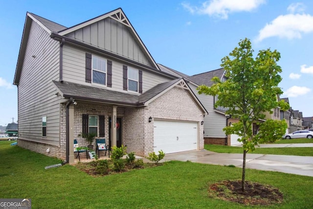 view of front of home with a garage and a front lawn