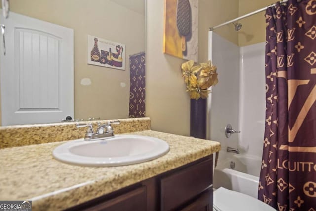 full bathroom with shower / tub combo, vanity, and toilet