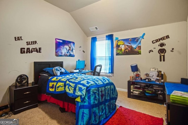 carpeted bedroom with vaulted ceiling