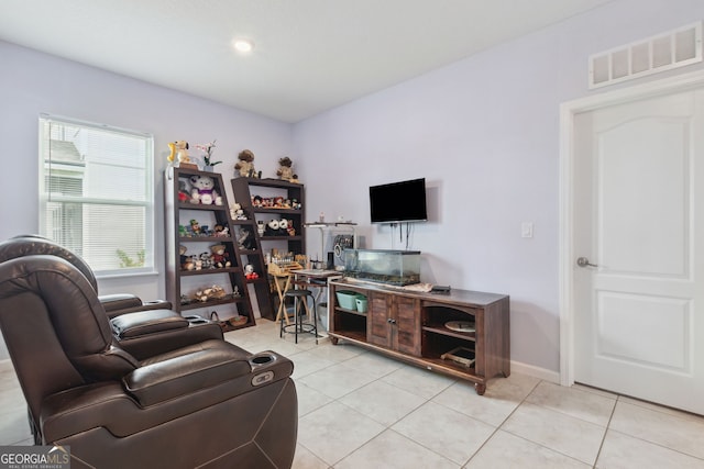 living room with light tile patterned floors