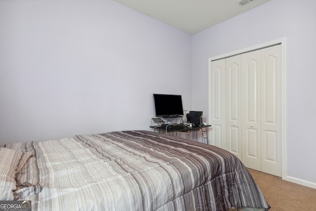 bedroom with carpet and a closet