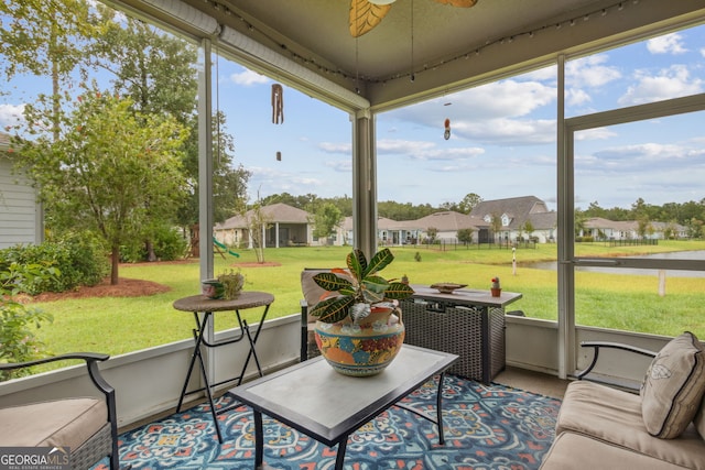 sunroom / solarium featuring a healthy amount of sunlight