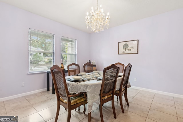 dining room featuring light tile patterned floors and a chandelier