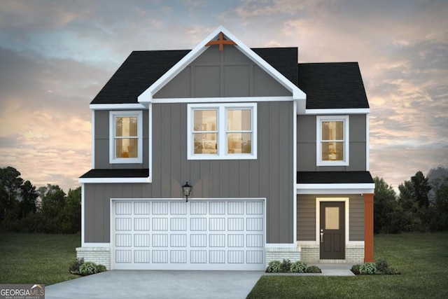 view of front facade featuring brick siding, concrete driveway, board and batten siding, a garage, and a front lawn