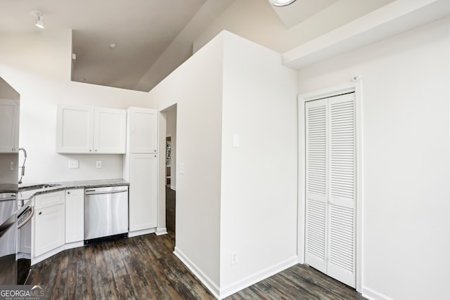 kitchen with dishwasher, dark hardwood / wood-style flooring, sink, and white cabinets