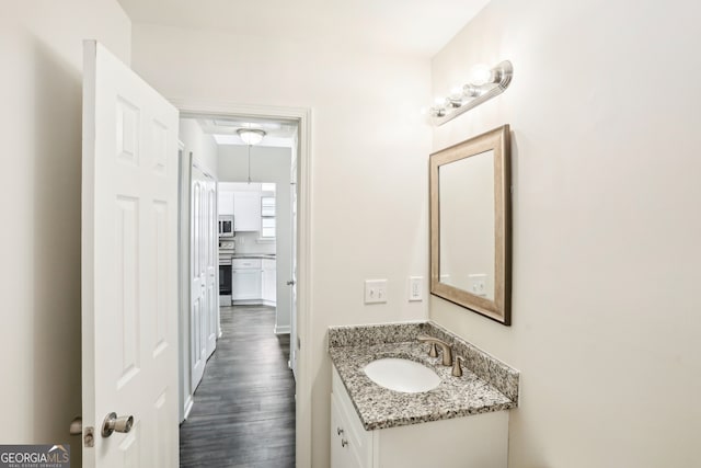 bathroom with vanity and hardwood / wood-style floors