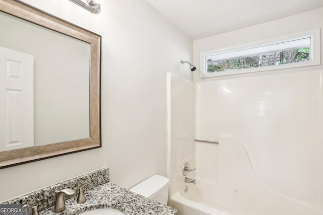 full bathroom with toilet, sink, and bathtub / shower combination