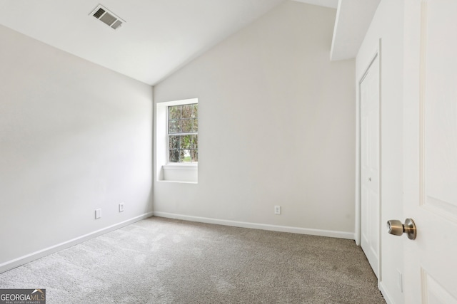 interior space featuring high vaulted ceiling and carpet floors